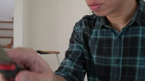 Engaged in Handyman Tasks with Tool Stock Footage 314612059