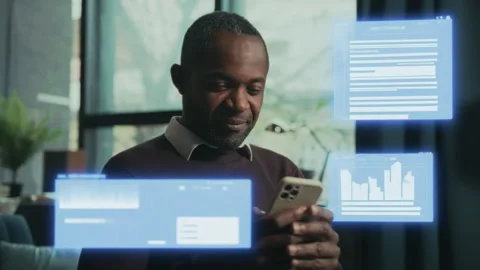 Engaged Professional Analyzes Data on Mobile Device Stock Footage 315001786
