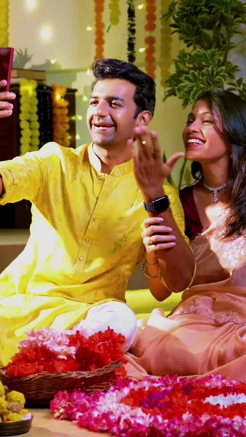 Engaged in video call celebration, Indian couple celebrating Diwali night Stock Footage 342382205