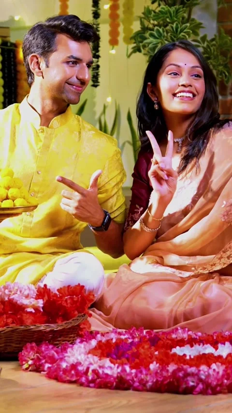 Engaged in video call celebration, Indian couple celebrating Diwali night Stock-Footage 342382217