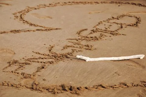 Engaged Written in Sand Stock Photos