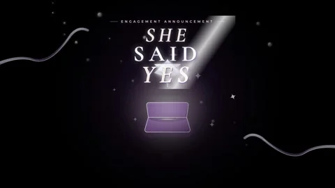 Engagement announcement with a ring box and the text she said yes Stock Footage 344576567
