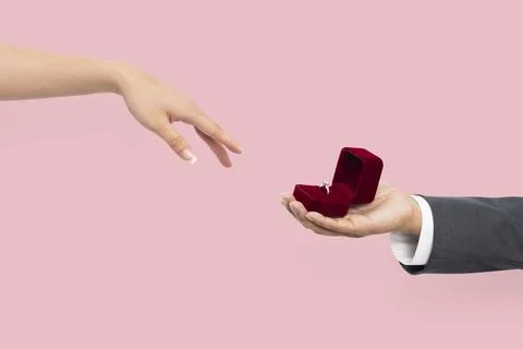 Engagement proposal hands with man and woman Stock Photos
