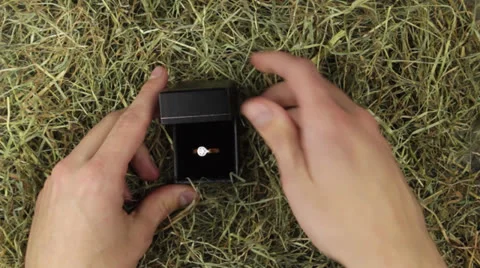 A engagement ring with a big diamond in straw Stock Footage 24919773