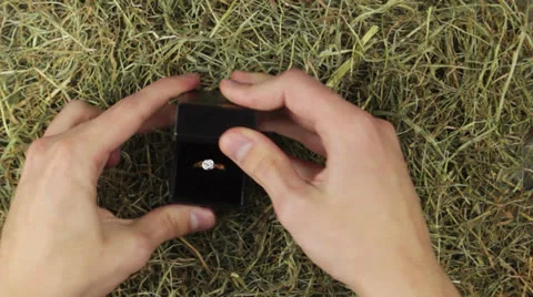 A engagement ring with a big diamond in straw Stock Footage 24921145