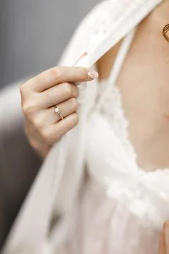 Engagement ring on bride's finger during wedding preparations Stock Photos