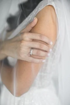 Engagement ring on bride's finger Stock Photos