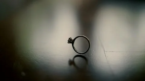 An engagement ring with a diamond rotates quickly and for a long time Stock-Footage 221512023