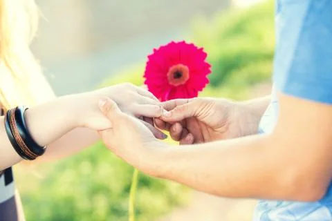 Engagement ring on a flower Stock Photos