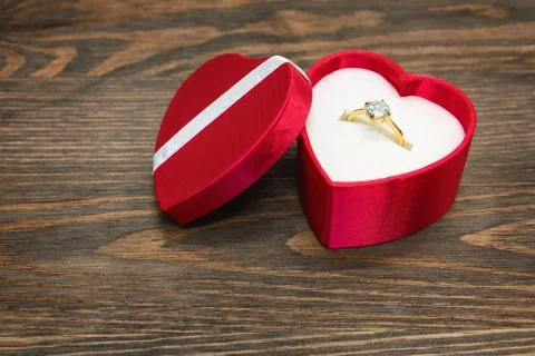 Engagement ring in heart shaped box Stock Photos
