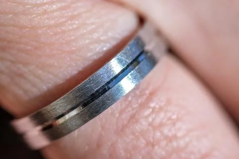 Engagement ring, silver ring in finger Stock Photos