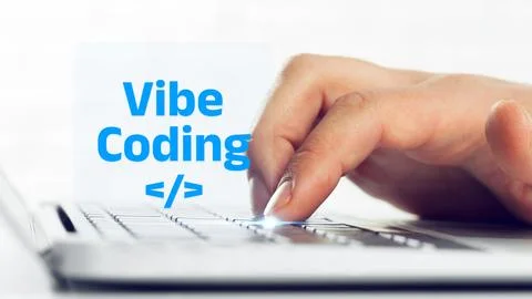 Engagement in vibe coding with hands on a keyboard 스톡 사진