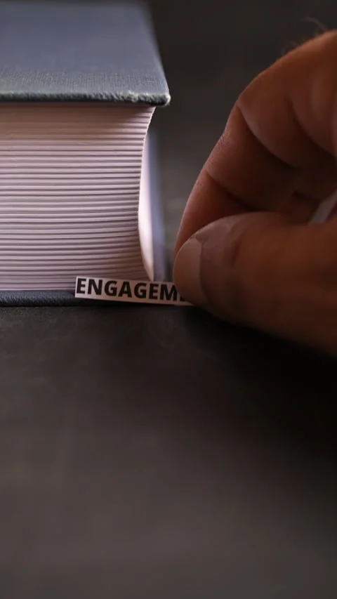 Engagement Word on Book — Connection, Commitment and Team Involvement Concept Stock Footage 338238304