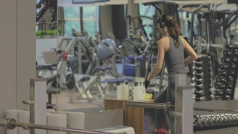 Engaging and Energetic Workout Session in a Modern and WellEquipped Gym Facility Video stock 315861076