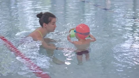 Engaging and Fun Swimming Lesson Session Between a Young Child and Their Stock-Footage 307240219