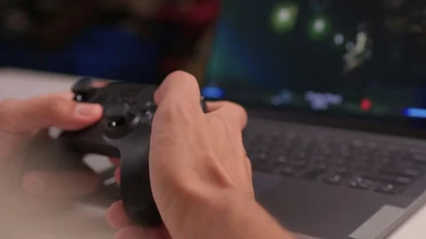 Engaging and immersive gaming session with a controller firmly in hand, ready Video stock 315138484