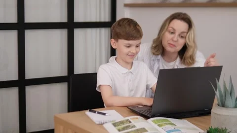 An Engaging and Interactive Learning Session Between a Child and an Adult for Stock Footage 312219860