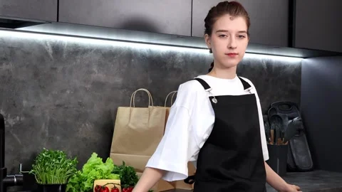 Engaging chef prepares for a culinary masterpiece in a modern kitchen 스톡 동영상 296317837