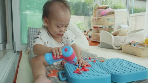 Engaging Child Playtime with Colorful Toys Vidéo 341142953