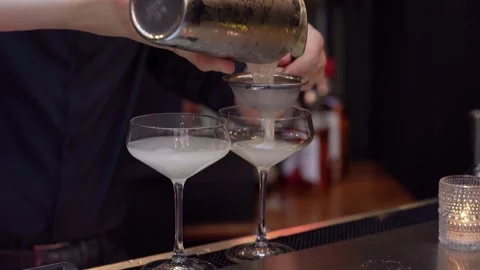 Engaging in Cocktail Preparation at a Classy and Modern Bar with Professional Stock-Footage 316513470