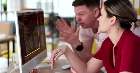 Engaging in Collaborative Programming Activities within a Modern Workspace Stock-Footage 295057653