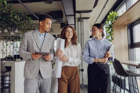 Engaging in a Collaborative Team Meeting within a Dynamic and Modern Office Stock Photos