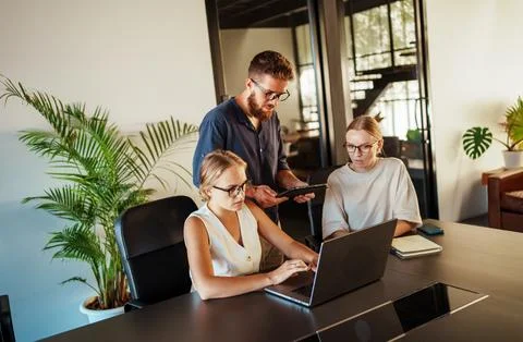 Engaging in a Collaborative Work Session within a Contemporary Modern Office Stock Photos