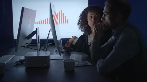 Engaging in Collaborative Working at Nighttime within a Versatile and Stock Footage 293368280