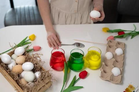 Engaging in a Colorful Easter Egg Decorating Experience for family fun and .. Stock Photos