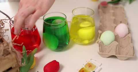 Engaging in a Colorful Easter Egg Dyeing Activity is a wonderful way to Stock Footage 306161837