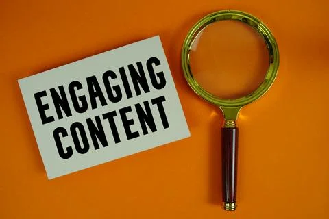 Engaging Content text written on paper with magnifying glass Stock Photos
