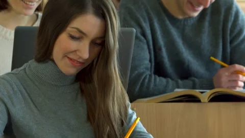 Engaging conversation between a female student and her male classmate Stock Footage 311981694