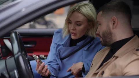 Engaging Conversation in a Luxury Car, Showcasing Deep Emotions and Unique Style Video stock 314763075