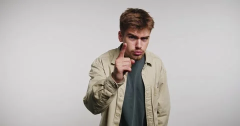 Engaging conversation unfolds with expressive gestures in a studio setting Vídeos de archivo 329112864