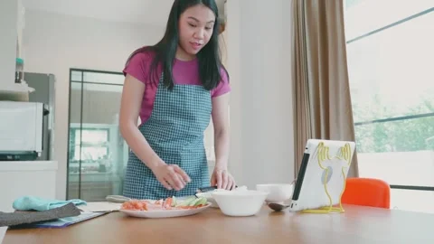 Engaging Cooking Experience in a Modern Kitchen Setting Stock Footage 313832553