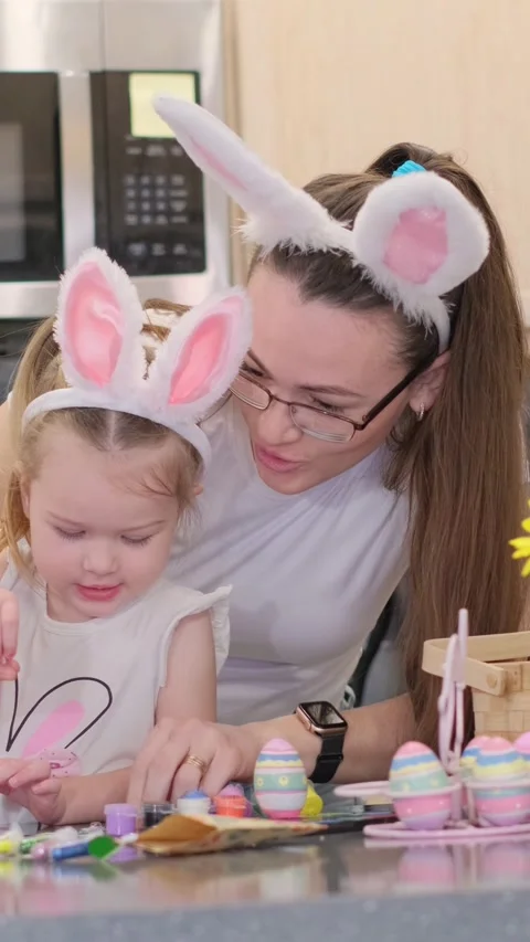 Engaging in Creative Easter Egg Decorating Activities Together with Your Stock-Footage 305856639