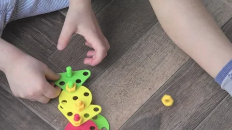Engaging in Creative Play with Colorful Building Toys for Kids Can Spark Stock Footage 305916622