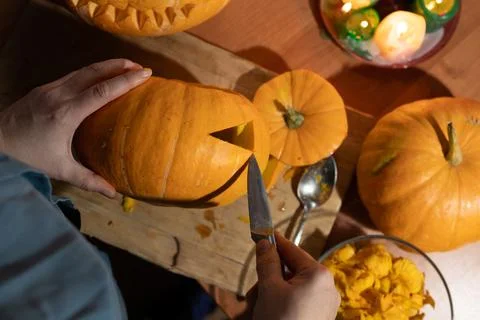 Engaging in Creative Pumpkin Carving is a funfilled activity perfect for Stock Photos
