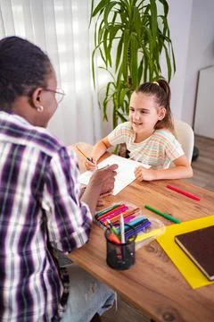 Engaging creativity between a mentor and a young artist Stock Photos