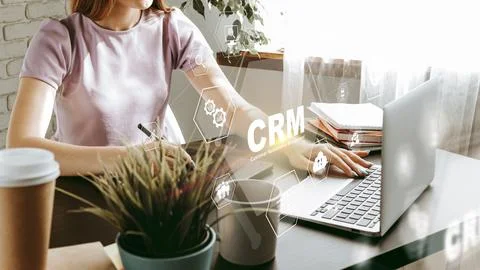 Engaging with CRM software for enhanced customer management in a modern Stock Photos