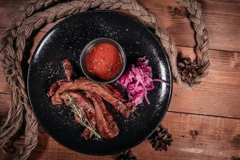 An engaging culinary composition features perfectly grilled strips of tender  Stock Photos