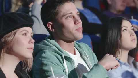 Engaging discussion between a guy and a girl about a film Stock Footage 311515960