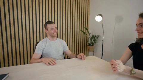 Engaging discussion between two participants in a split screen call Video stock 305550425