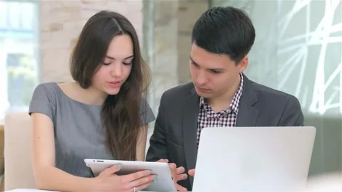 Engaging discussion on data analysis with a tablet Stock Footage 311926899