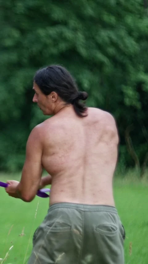 Engaging in Dynamic Outdoor Workout sessions that feature vibrant Purple Stock Footage 308041647