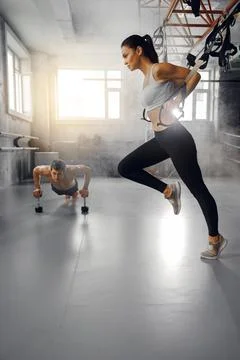 Engaging Dynamic Workout Session Featuring Both Strength Training Methods and Stock Photos