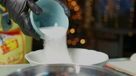 Engaging in Holiday Baking Preparation with Various Bowls Stock Footage 295759888
