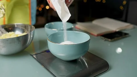 Engaging in Holiday Baking Preparation with Various Bowls Vidéo 295759963