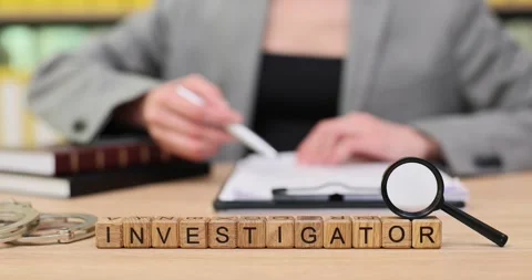 Engaging investigation process unfolds with a focus on notes and magnifying Stock Footage 320630809
