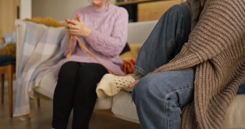 Engaging knitting session at home with friends creates cozy atmosphere and warm Stock Footage 308387949